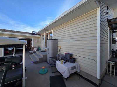 Home Siding Installation Blue House