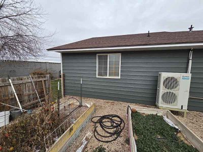 New Exterior Siding Installation Blue House